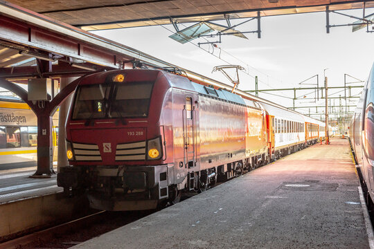 Gothenburg, Sweden - March 12 2022: Siemens Vectron locomotive pulling a Snälltåget train.