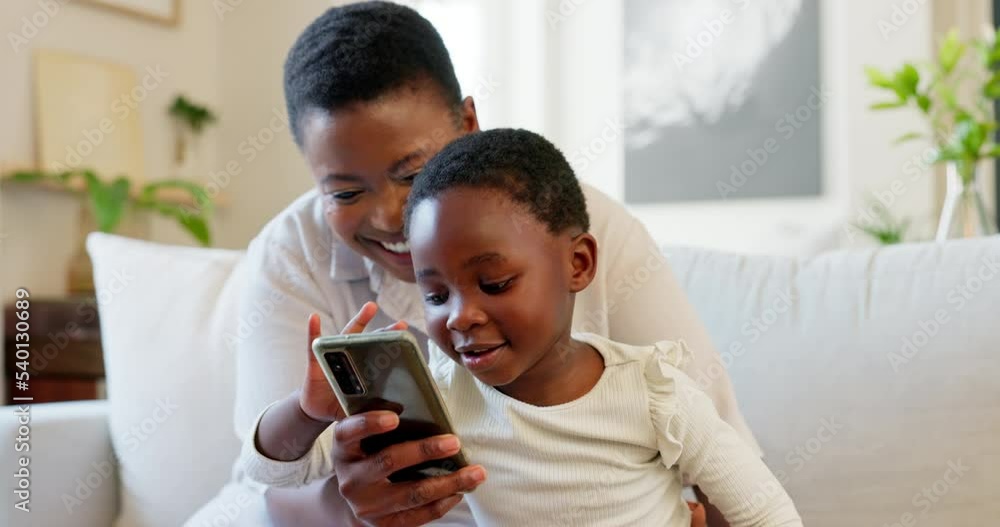 Poster Social media, mother and child with a phone on the sofa for learning, education and communication in their house. Happy, smile and African baby and mom reading a chat on a mobile app on the couch