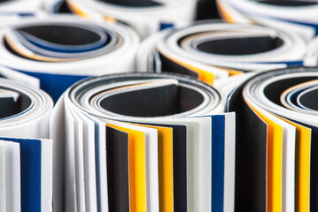 Group of rolled up magazines close up