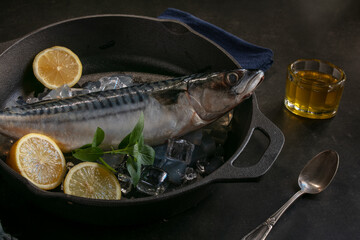 Raw fish presented in a metal dish