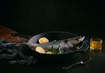 Raw fish presented in a metal dish