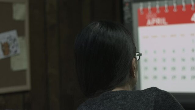 Young Female Office Employee Performs Tasks at Her Desk 4K