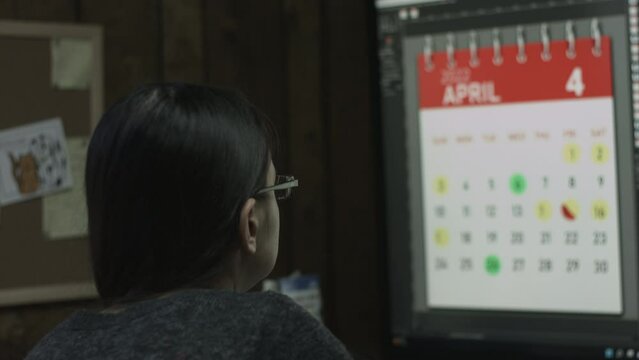 Young Female Office Employee Performs Tasks at Her Desk 4K