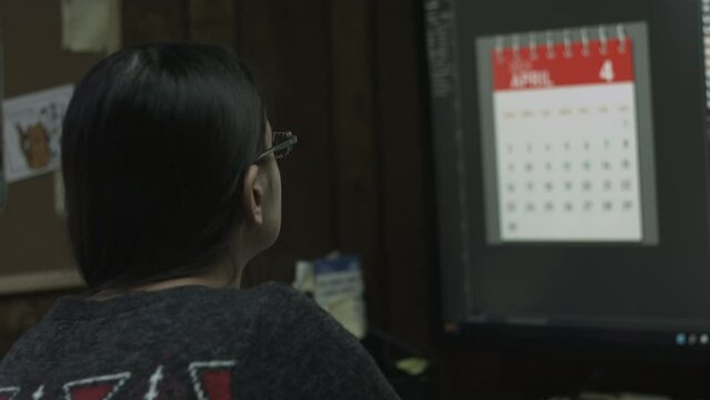 Young Female Office Employee Performs Tasks at Her Desk 4K