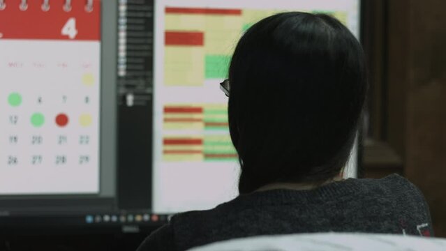 Young Female Office Employee Performs Tasks at Her Desk 4K
