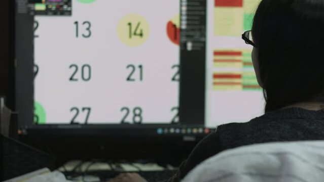 Young Female Office Employee Performs Tasks at Her Desk 4K