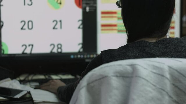 Young Female Office Employee Performs Tasks at Her Desk 4K