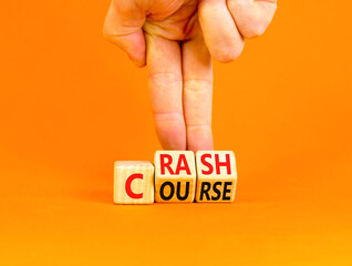 Crash course symbol. Concept words Crash course on wooden cubes. Beautiful orange table orange background. Businessman hand. Business crash course concept. Copy space.