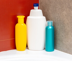 Containers and bottles of different sizes, shapes and colors for cleanser, conditioner, soap and shampoo in the bath. Natural organic cosmetics, packaging with an empty label, branding layout.