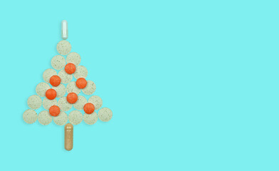 Christmas tree made of multicolored tablets .New Year and Christmas concept .Health, medicine and pharmacy.copy space