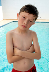 Happy american boy in swimsuit.