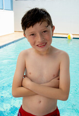 Happy american boy in swimsuit