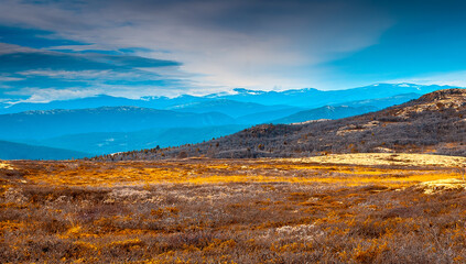 Landscape with sky. Autumn in Rondane. Autumn landscape in Rondane National Park in Norway.