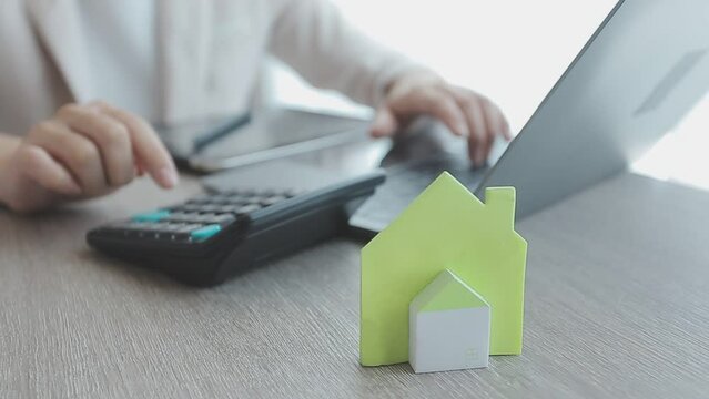 Real estate agent with client or architect team discussing project on tablet computer