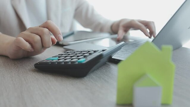 Real estate agent with client or architect team discussing project on tablet computer