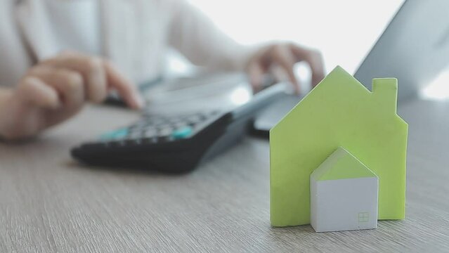 Real estate agent with client or architect team discussing project on tablet computer