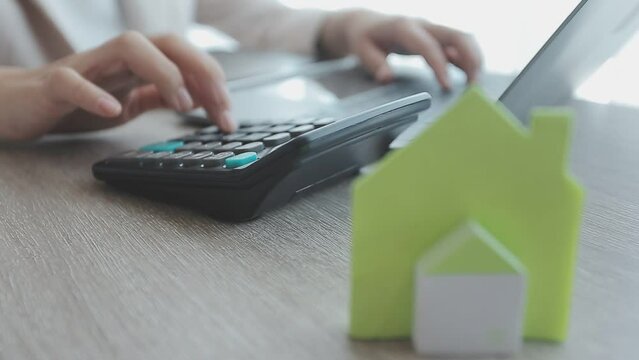 Real estate agent with client or architect team discussing project on tablet computer