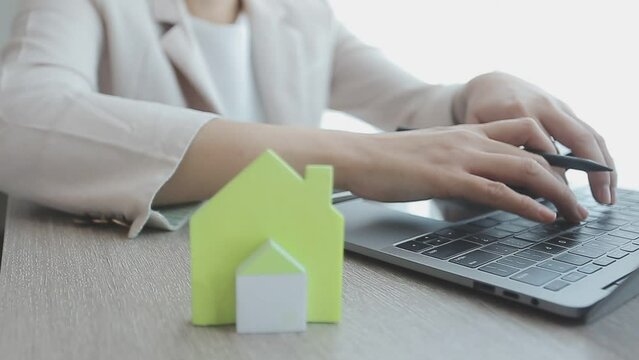 Real estate agent with client or architect team discussing project on tablet computer
