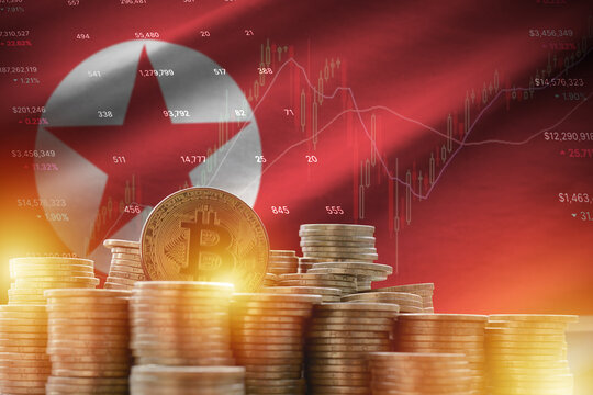 North Korea flag and big amount of golden bitcoin coins and trading platform chart. Crypto currency - Powered by Adobe