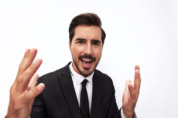 Portrait of a man in an expensive business suit close-up wide-angle lens pulls his hands into the camera with open mouth surprise happiness smile with teeth on a white background, copy space