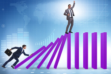 Businessman in domino effect concept