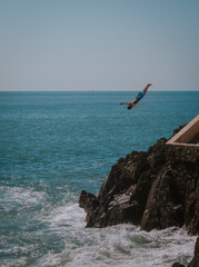 cliff diver mid jump