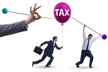 Businessman in tax balloon concept