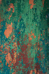 Wall with paint peeling off. Destroyed, destroyed. Blue, orange, brown board. Door. Background, wallpaper.