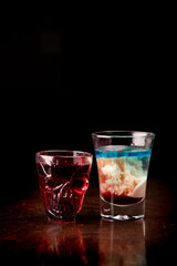 creepy halloween shot in skull cup and brain hemorrhage shot on dark background front view