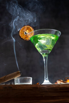 special alcoholic drinks cannabis and worm vodka little bottle weed green  alcohol party hard drink absinth red blue smoke drog d Stock Photo - Alamy