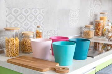 pasta in the jar. on kitchen shelves are different kinds of pasta in glass jars and Gas stove in modern kitchen