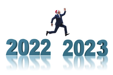 Businessman jumping from the year 2022 to 2023