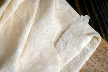 Fresh and soft wheat lavash on a board