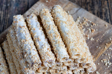 waffle tube with chocolate filling and crushed peanuts