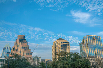 Fototapeta na wymiar View of Austin Texas skyline with vast blue sky and sparse clouds in background