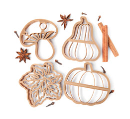 Different cookie cutters and spices on white background, top view