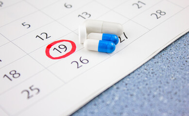 Monitoring the intake of medications, medicines. Pills and a calendar. Schedule of treatment or medication. Medication course.