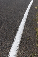 Paved highway with white road markings