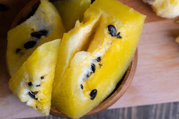 Ripe and juicy yellow watermelon cut into pieces