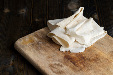Fresh and soft wheat lavash on a board