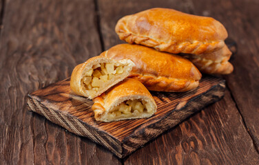 baked pies on a wooden background