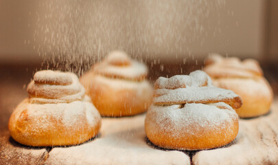 A delicate choux pastry filled with whipped cream, topped with a crispy craquelin layer and a chocolate garnish, isolated on a white background