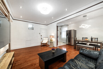 Luxury renovated furnished apartment in Montreal with finished basement, backyard, loundry, bedrooms, living room an kitchen