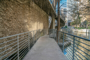 Walkway trail with view of the canal in San Antonio River Walk in Texas