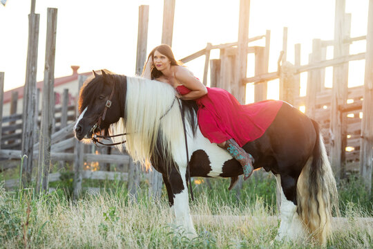 Girl in Red Dress on Horse