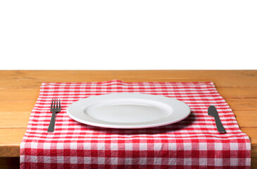 White Plate on napkin on wooden table