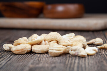 Peeled raw cashew nuts on the table