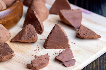 Cut into pieces truffle candy on a board