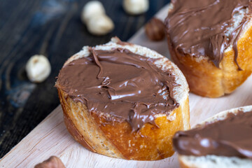 chocolate butter spread on a baguette, close up