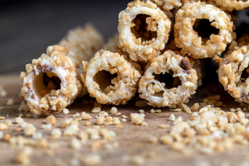waffle tube with chocolate filling and crushed peanuts